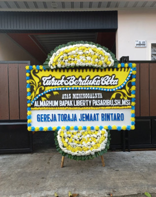 Papan Bunga Duka di Wirana